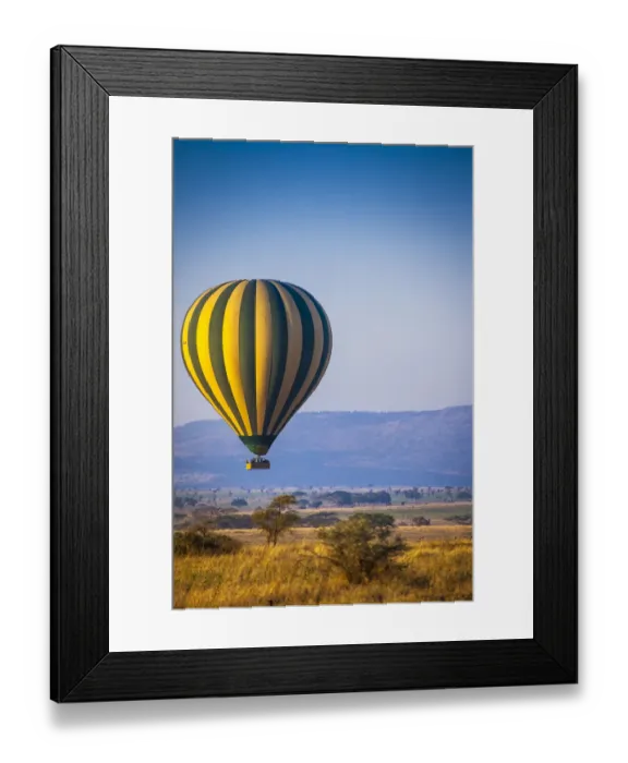 Framed Print : A hot-air balloon slowly traverses over the Serengeti plain Framed Print : A hot-air balloon slowly traverses over the Serengeti plain