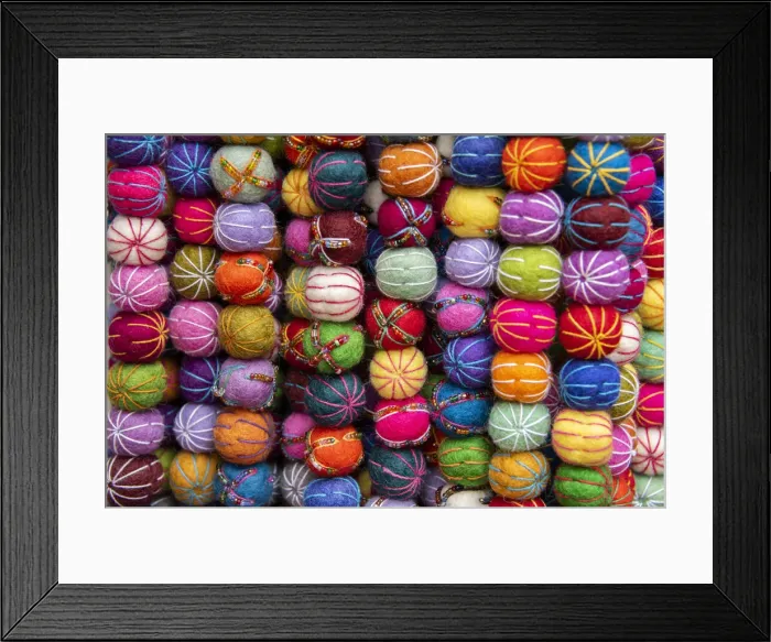 Framed Print : Singapore, Chinatown. Detail of typical textile round wool hanging ball souvenirs