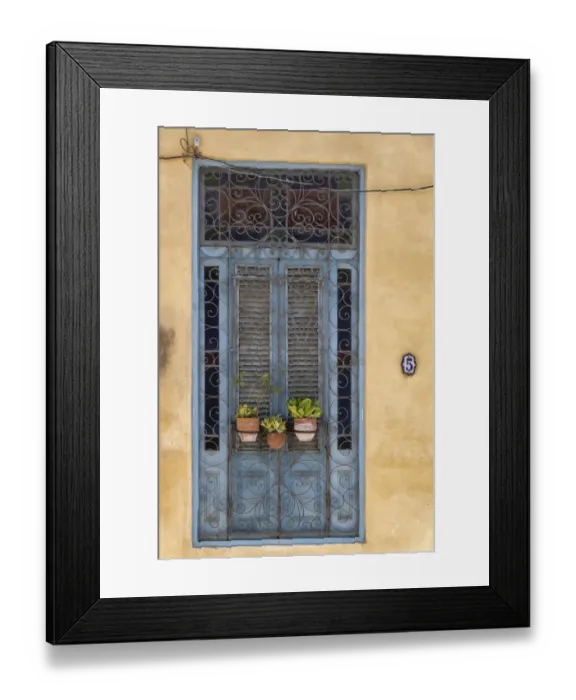 Framed Print : Three flower pots sit in wrought iron gate in front of blue door in Old Havana Framed Print : Three flower pots sit in wrought iron gate in front of blue door in Old Havana