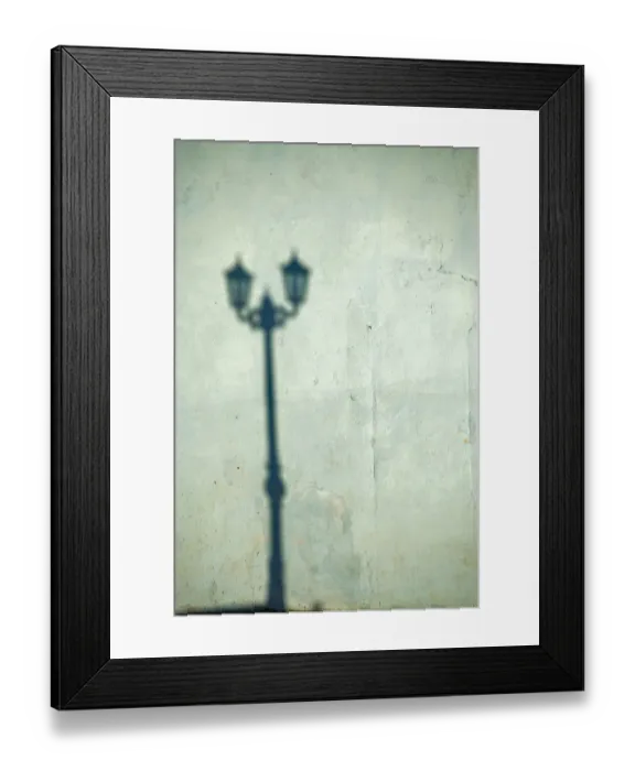 Framed Print : Morning shadow of a lamppost on light blue-green house wall in Trinidad, Cuba