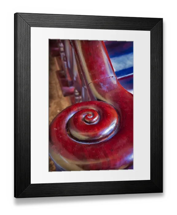 Framed Print : Snail shell-like curve on red wooden bannister handrail in Trinidad, Cuba