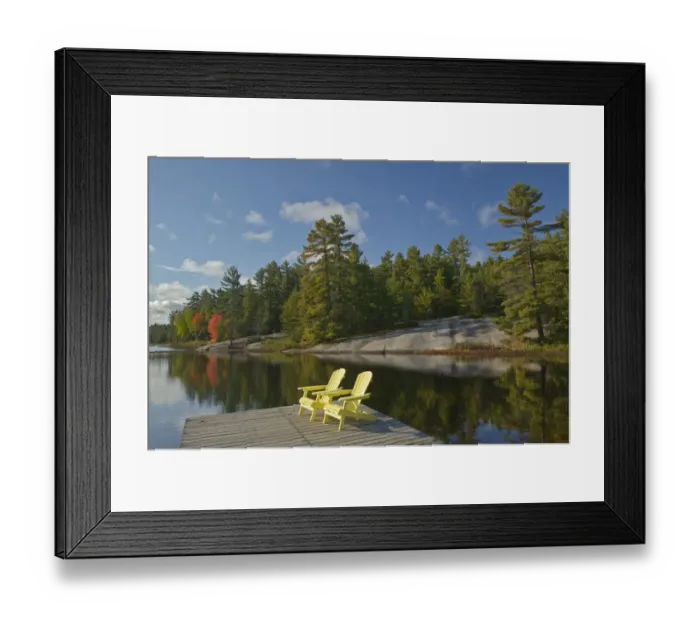 Framed Print : Canada, Ontario, Grundy Lake Provincial Park. Muskoka chairs on lake dock