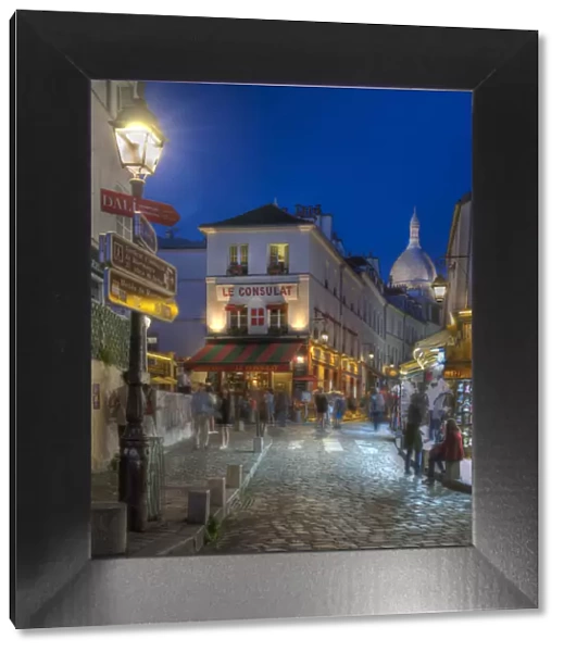 Night street scene in Montmartre district in Paris, France
