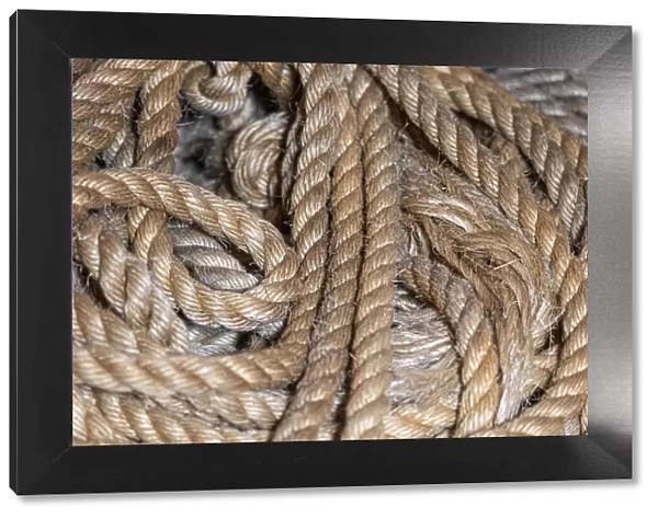 Coiled natural fiber fishing rope used in Nova Scotia fishing vessels