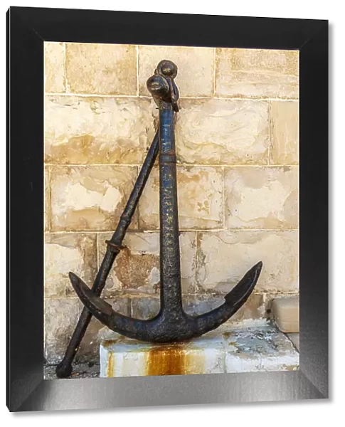 Italy, Apulia, Metropolitan City of Bari, Giovinazzo. Old rusted anchor in front of a
