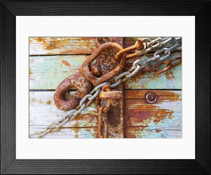 Framed Print : Rusty lock and chain on light blue wood
