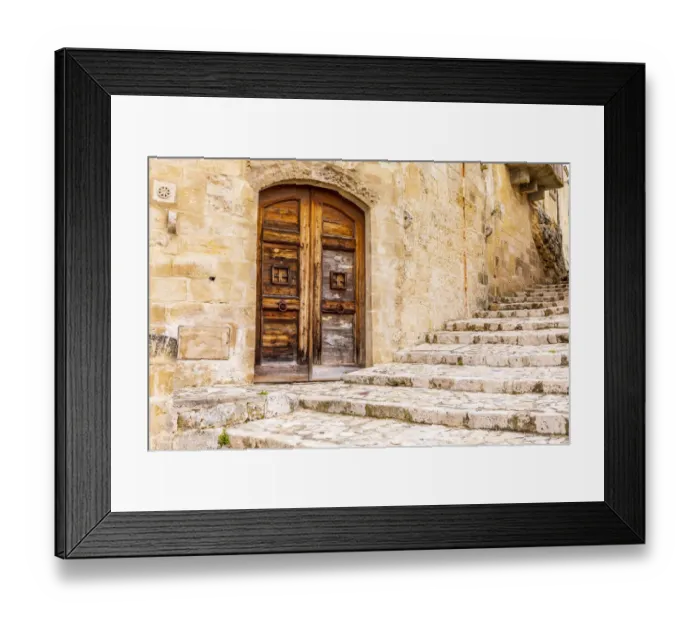 Framed Print : Italy, Basilicata, Province of Matera, Matera. Old wooden door in a stone wall above Framed Print : Italy, Basilicata, Province of Matera, Matera. Old wooden door in a stone wall above