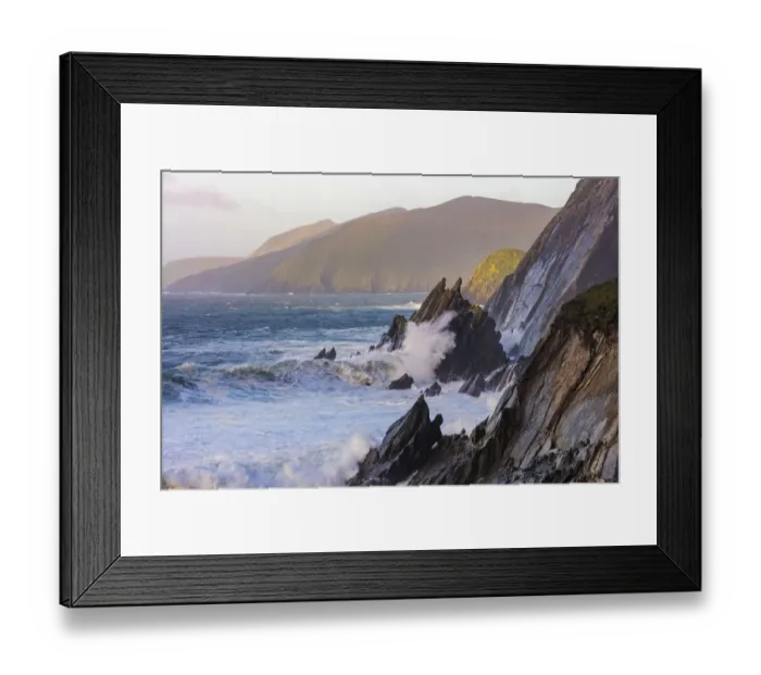 Framed Print : Waves crash into cliffs on Dunmore Head with Blasket Islands on the Dingle Peninsula
