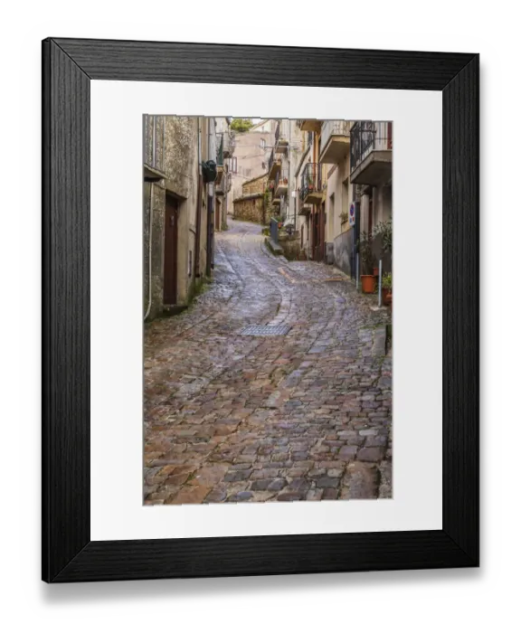 Framed Print : Italy, Sicily, Palermo Province, Geraci Siculo. Winding narrow cobblestone street in Framed Print : Italy, Sicily, Palermo Province, Geraci Siculo. Winding narrow cobblestone street in