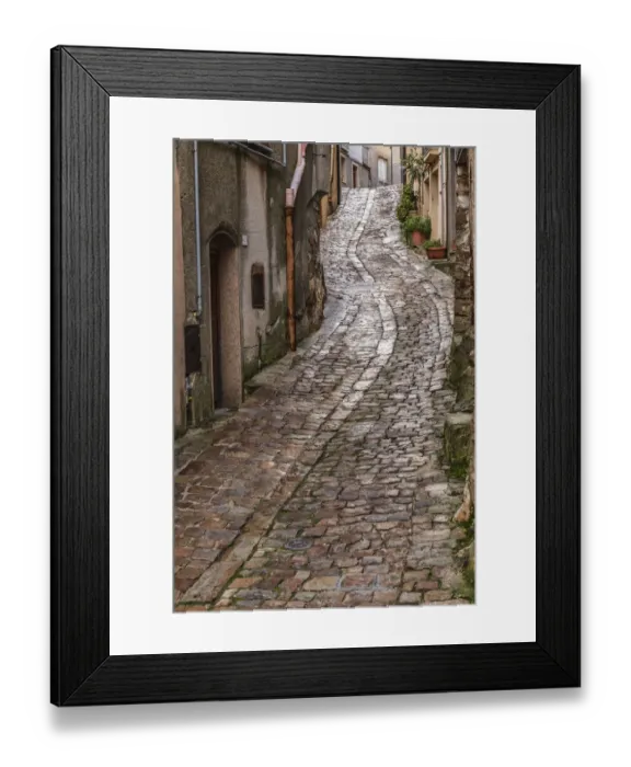 Framed Print : Italy, Sicily, Palermo Province, Geraci Siculo. Winding narrow cobblestone street in Framed Print : Italy, Sicily, Palermo Province, Geraci Siculo. Winding narrow cobblestone street in