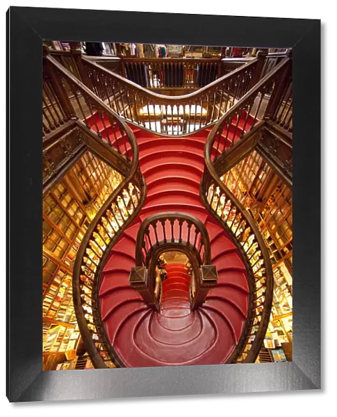 Portugal, Porto. Ornate staircase in the Lello Bookstore