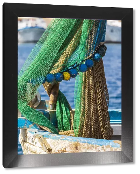 Italy, Sicily, Palermo Province, Santa Flavia. Net on a small fishing boat in the harbor