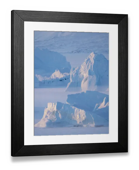Framed Print : Icebergs frozen into the sea ice of the Uummannaq Fjord System during winter Framed Print : Icebergs frozen into the sea ice of the Uummannaq Fjord System during winter