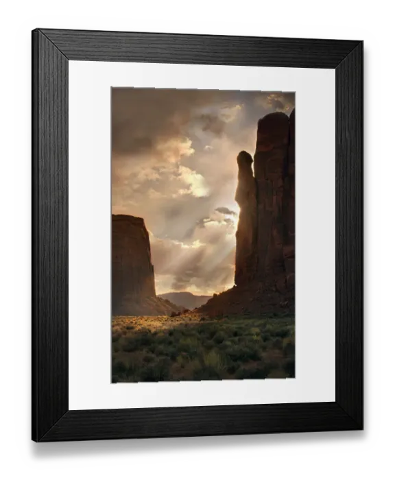 Framed Print : Light rays filter down into Monument Valley, on the Arizona and Utah border Framed Print : Light rays filter down into Monument Valley, on the Arizona and Utah border