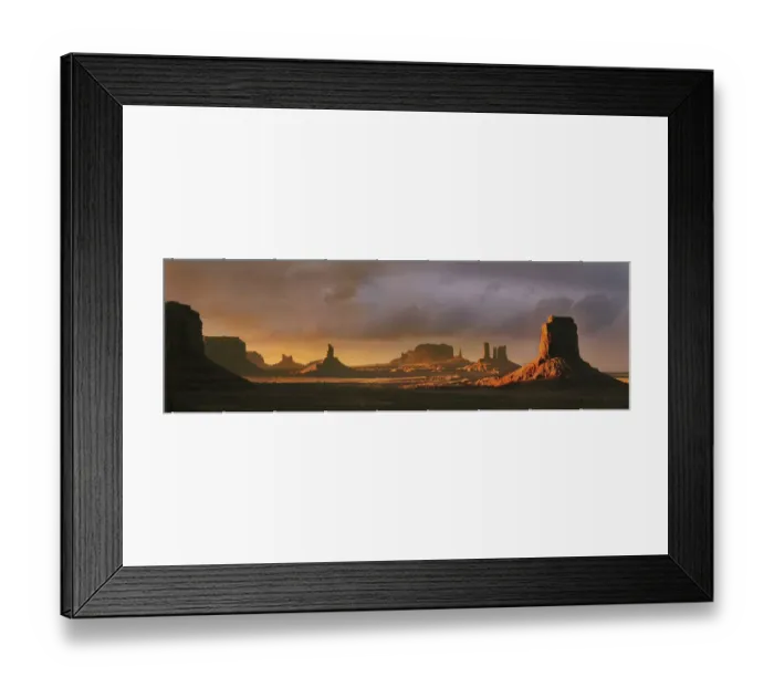 Framed Print : Last light bathes Monument Valley in deep oranges and lavenders on the Arizona