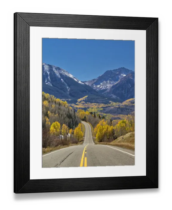 Framed Print : USA, Colorado. An empty Colorado highway 145 in midday surrounded by fall color near
