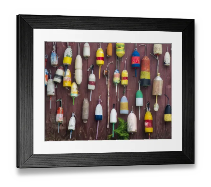 Framed Print : USA, Maine. Colorful buoys hanging on the exterior of a building