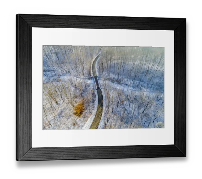 Framed Print : Aerial view of forest and road after snowfall in winter Stephen A Framed Print : Aerial view of forest and road after snowfall in winter Stephen A