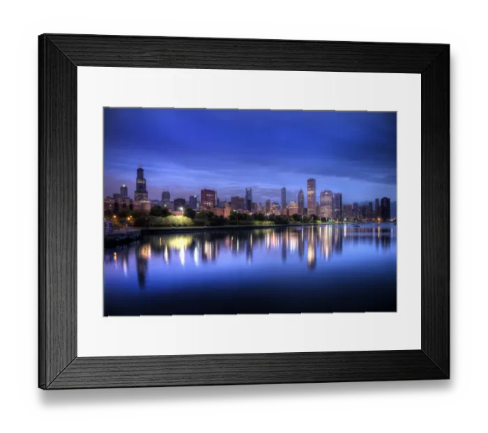 Framed Print : Chicago skyline reflects in lake Michigan during a blue sunrise Framed Print : Chicago skyline reflects in lake Michigan during a blue sunrise