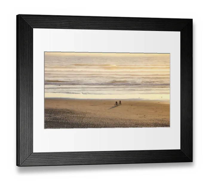 Framed Print : USA, Oregon, Cape Arch with two riding bikes on the beach in the evening light Framed Print : USA, Oregon, Cape Arch with two riding bikes on the beach in the evening light