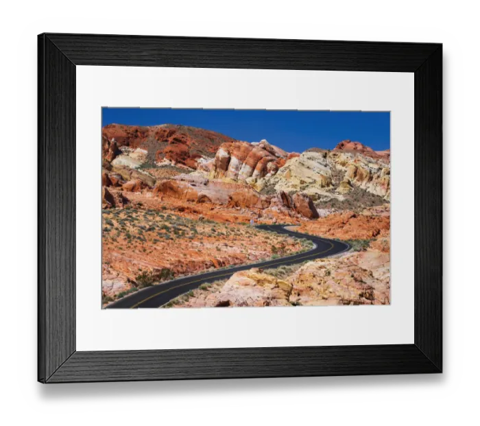 Framed Print : The park road winding through colorful sandstone (hikers visible)
