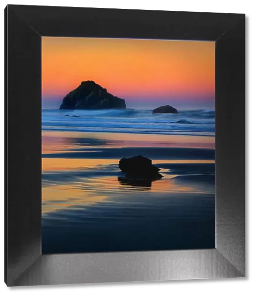 USA, Oregon, Bandon. Face Rock sea stack at sunset. Credit as