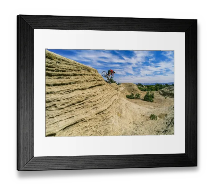 Framed Print : Mountain biker balances courage and danger and attempting to avoid crash on Red Rock Framed Print : Mountain biker balances courage and danger and attempting to avoid crash on Red Rock