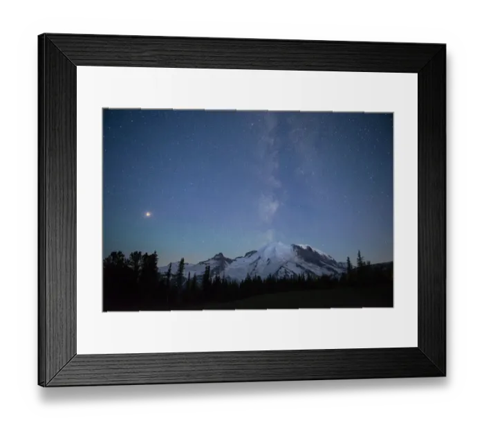 Framed Print : The lights of climbers can be seen on the mountain as the Milky Way rises behind Mt
