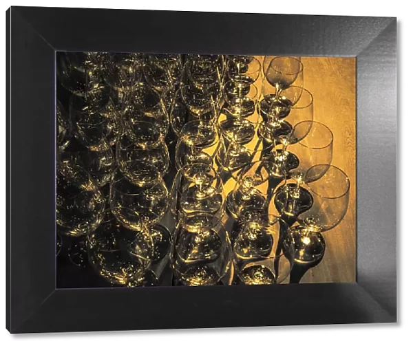 USA, Washington State, Walla Walla. Pattern of empty wine glasses in rich sunlight