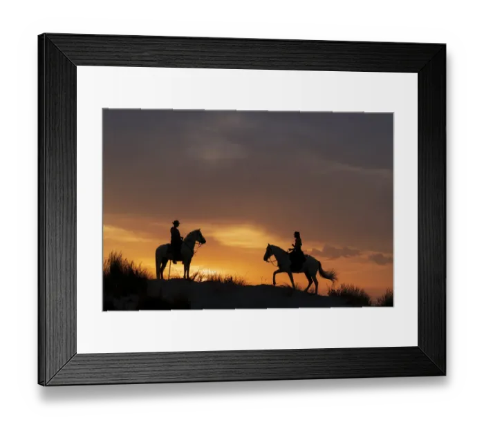 Framed Print : Europe, France, Provence. Silhouette of Camargue horses with guardian riders at sunrise