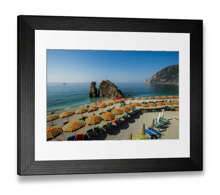 Framed Print : Beach umbrellas lining the beach in Monterosso al Mare, Cinque Terre, Italy