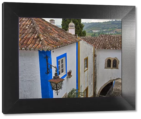 Portugal, Obidos. Graphic buildings inside the White walled town