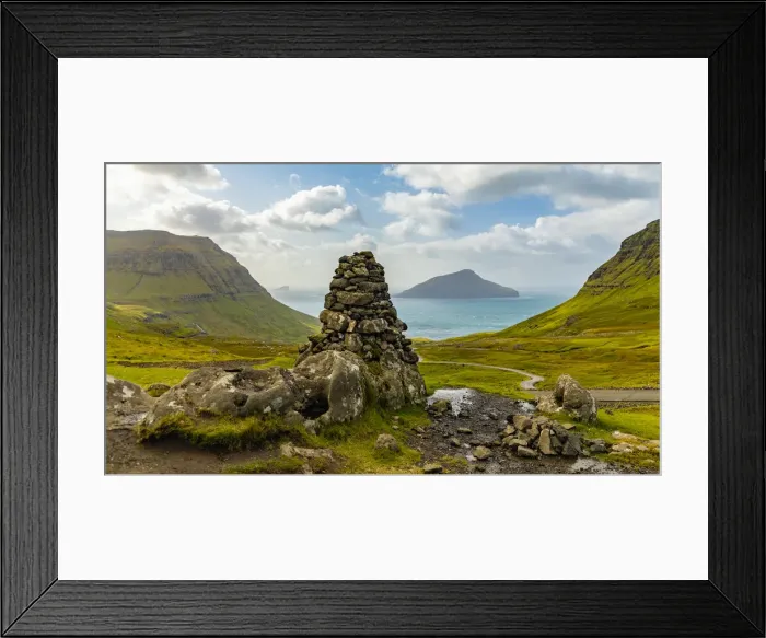 Framed Print : Europe, Faroe Islands. View of stone pillar overlooking the bay on the road to Framed Print : Europe, Faroe Islands. View of stone pillar overlooking the bay on the road to