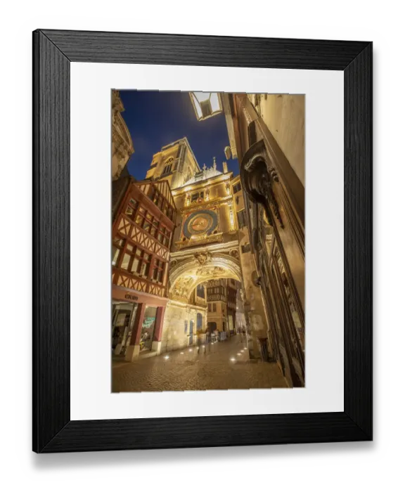 Framed Print : Europe, France, Rouen. Medieval clock on building at twilight