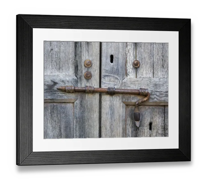 Framed Print : Italy, Tuscany. Unique metal door lock on an old wooden door