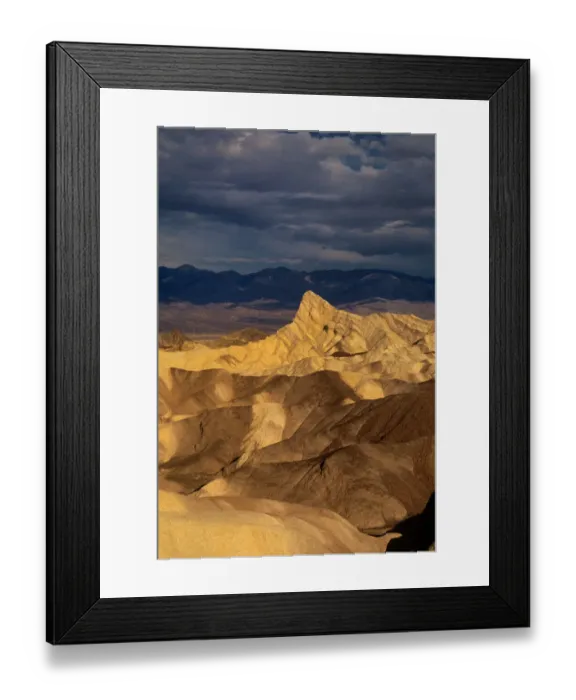 Framed Print : USA, California, Death Valley National Park. Clearing storm over sandstone formations