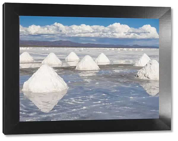 Bolivia, Uyuni, Salar de Uyuni. Cones of salt have been scraped up so that the salt will