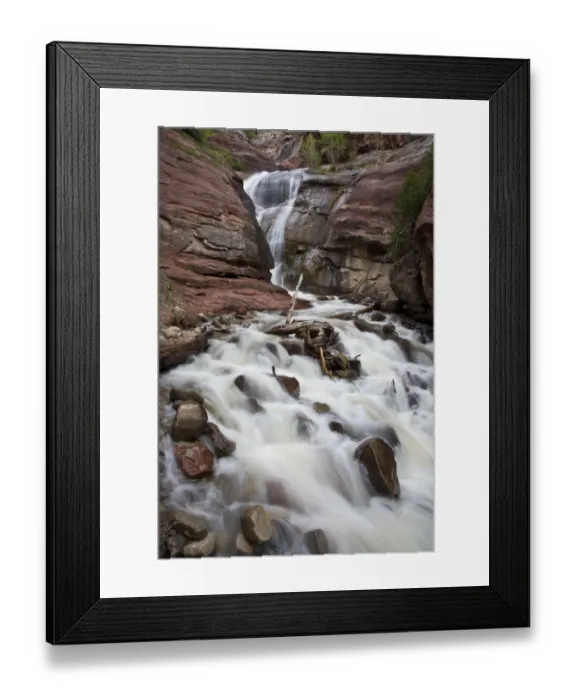 Framed Print : USA, Colorado. Moss and lichen cover rocks lining a cascading mountain stream in southern