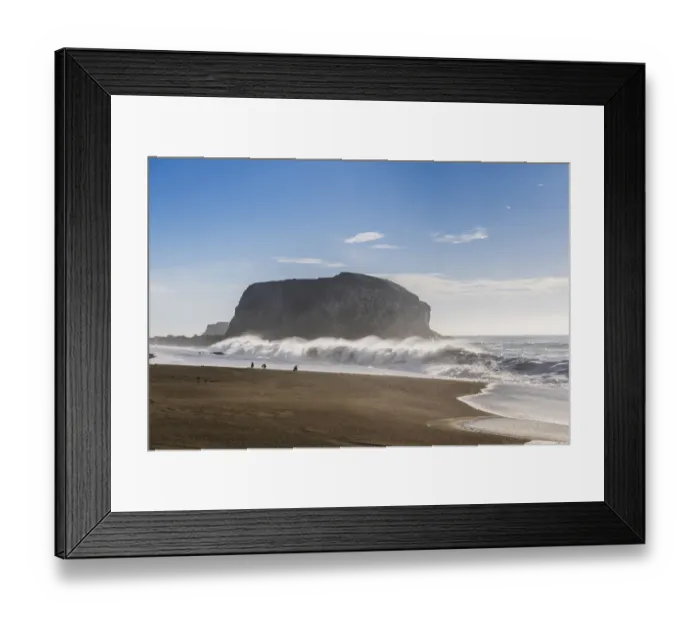 Framed Print : Large haystack rock with crashing waves and birds on the beach in California Framed Print : Large haystack rock with crashing waves and birds on the beach in California