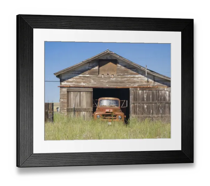 Framed Print : Old orange truck in an old garage