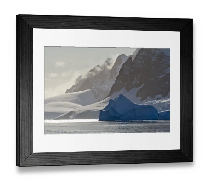 Framed Print : Landscape of snow covered island with iceberg in South Atlantic Ocean, Antarctica Framed Print : Landscape of snow covered island with iceberg in South Atlantic Ocean, Antarctica