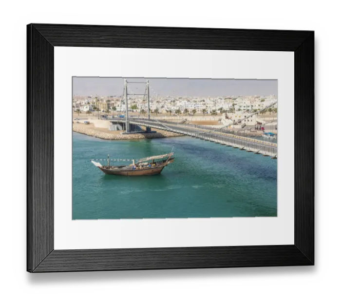 Framed Print : Middle East, Arabian Peninsula, Oman, Al Batinah South. Dhow passing under a suspension