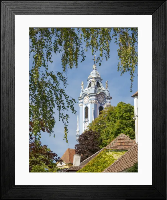 Framed Print : The collegiate church. Historic town Durnstein located in wine-growing area Framed Print : The collegiate church. Historic town Durnstein located in wine-growing area
