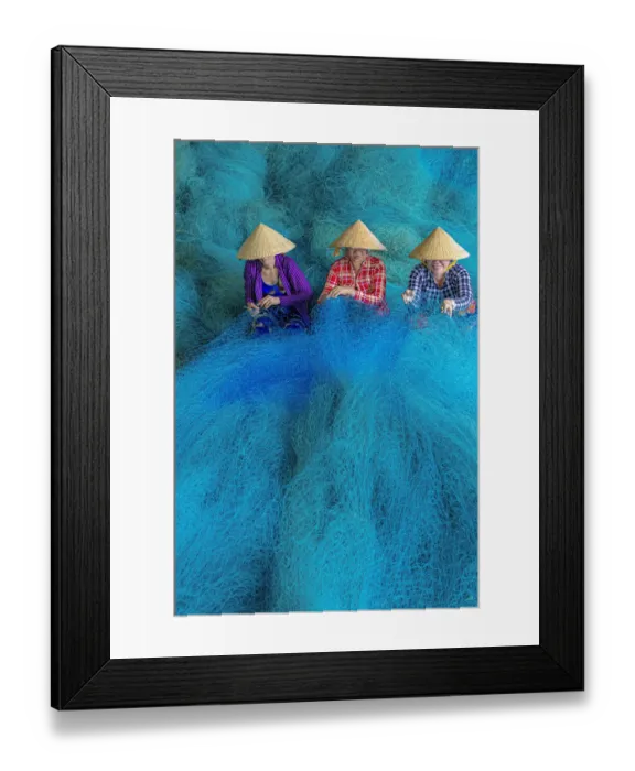 Framed Print : Vietnam. Women repairing fishing nets