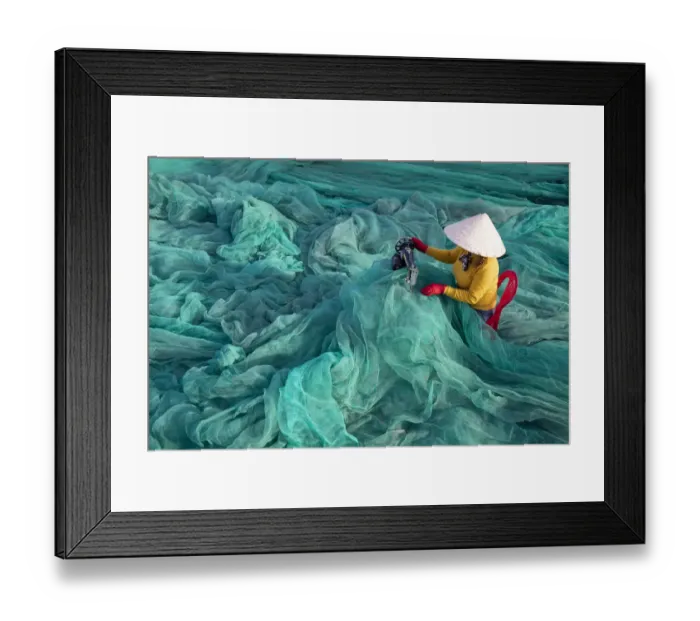 Framed Print : Vietnam. Fishing net analysis and repair with old fashioned manual sowing machine Framed Print : Vietnam. Fishing net analysis and repair with old fashioned manual sowing machine