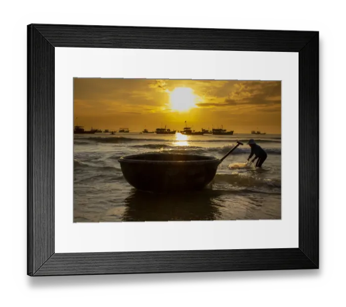 Framed Print : Vietnam. Fishermen deliver the nights catch to the beach at Hoi An