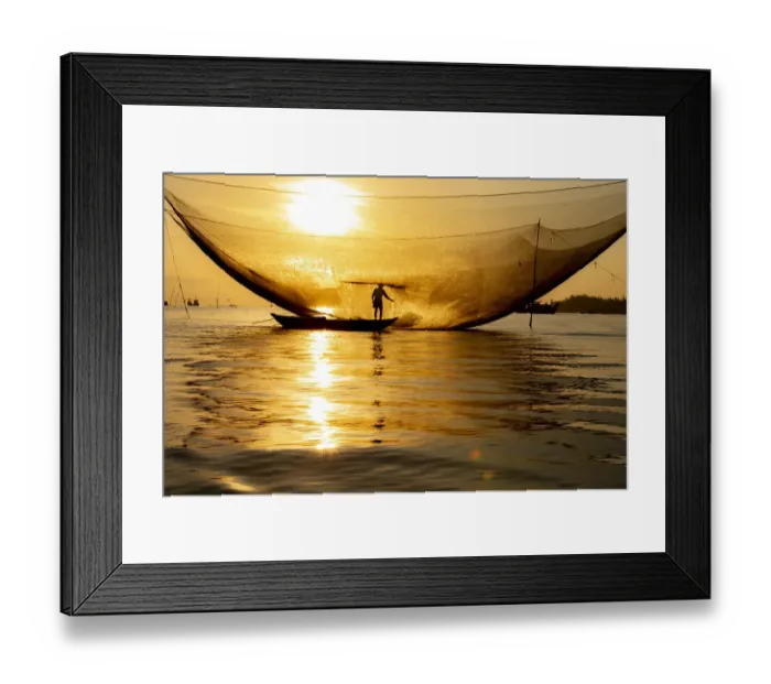 Framed Print : Vietnam. Fisherman emptying the nights catch in the Lagoon