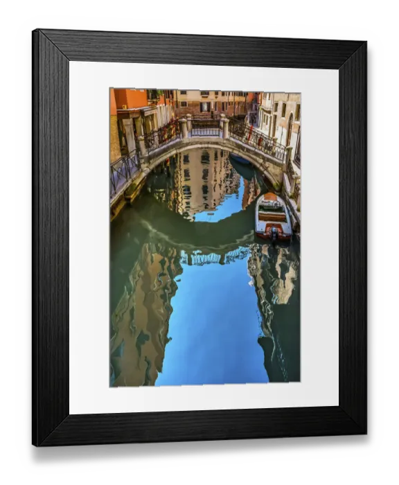 Framed Print : Colorful small canal and bridge creates beautiful reflections in Venice, Italy
