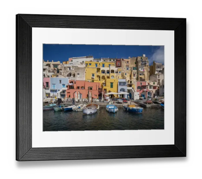 Framed Print : Europe, Italy, Procida. City houses and boats in Marina Corricella