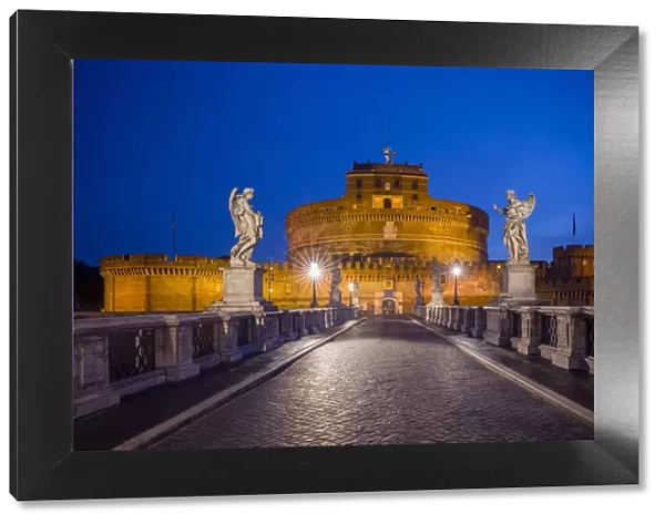Europe, Italy, Rome. Bridge to Castel Sant Angelo lit at night